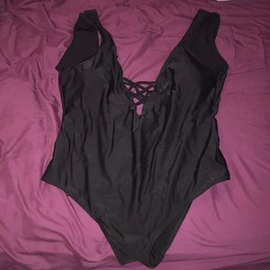 One piece black bathing suit